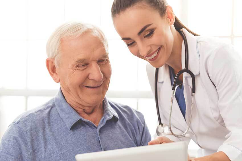 Female doctor reading with man